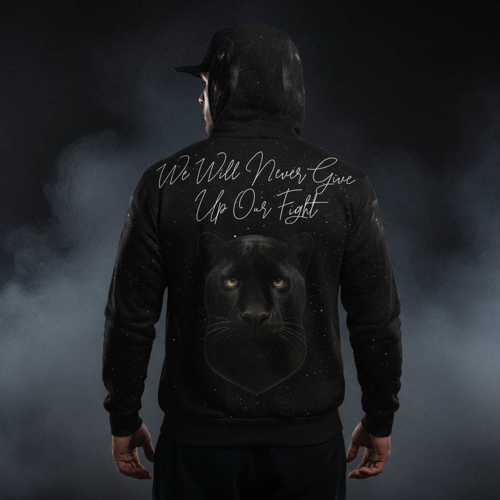 Person wearing a black hoodie with a panther design and text on the back against a dark background