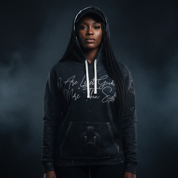 Person wearing a black hoodie with panther and text against a dark background 