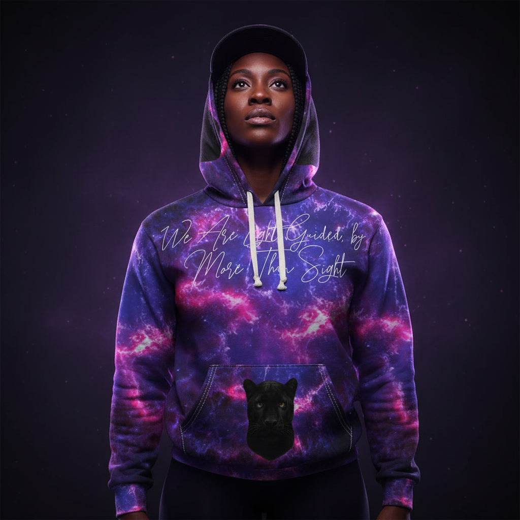 Person wearing a hoodie with a galaxy design and text on a dark background