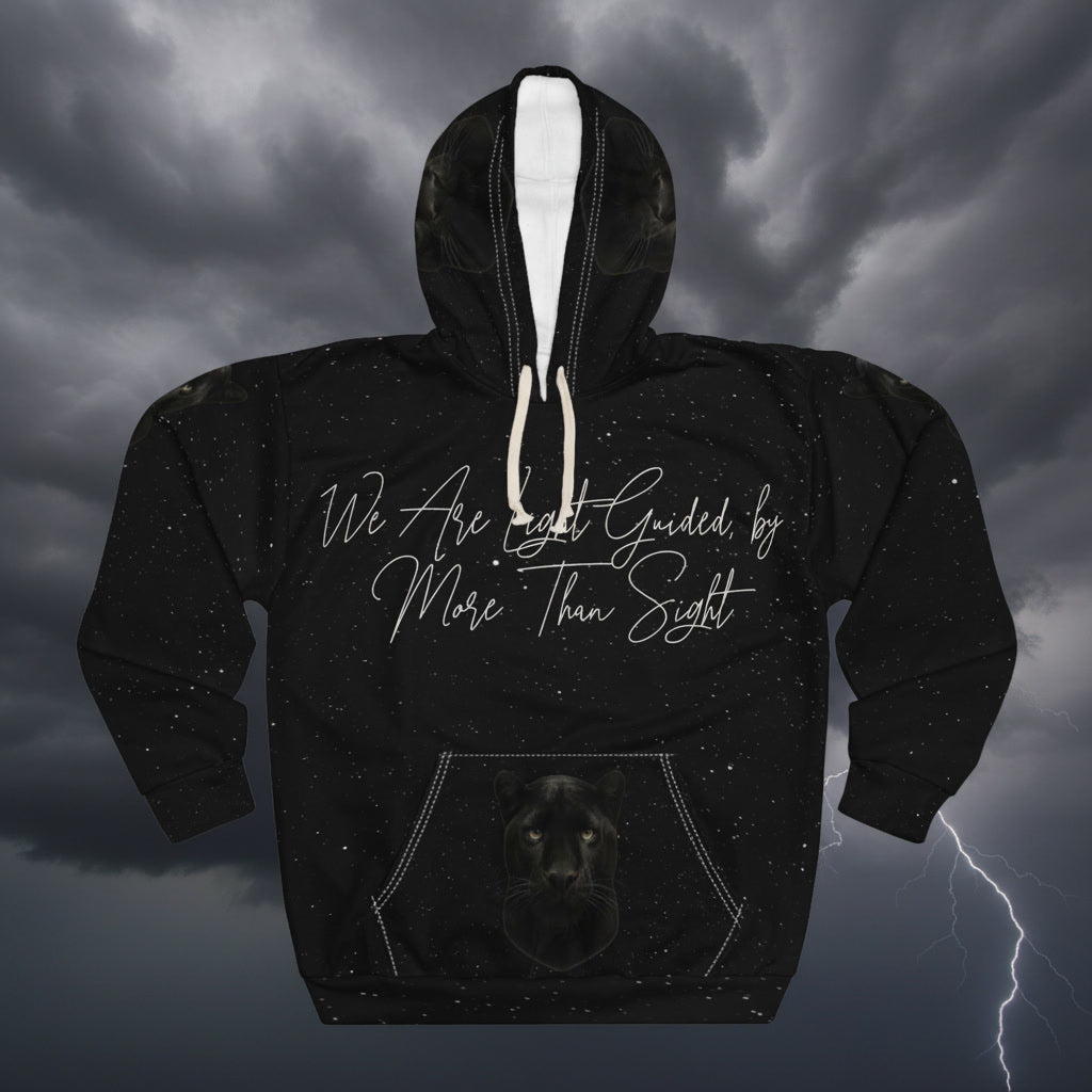 Black hoodie with text and a panther illustration on a dark sky background